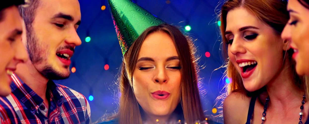 woman blowing a candle