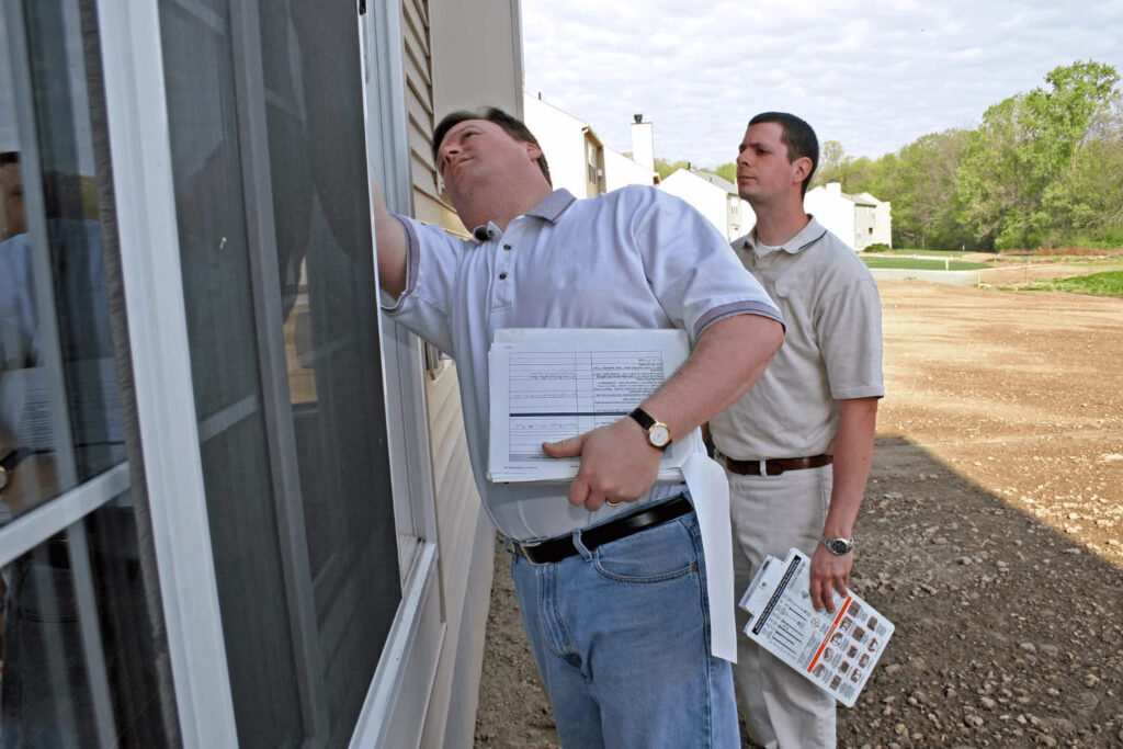 inspector checking a house foundation