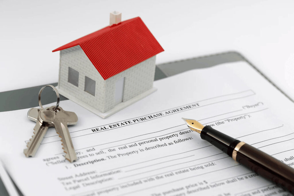 Pleasant Hill Realtor real estate paperwork with a pen and key