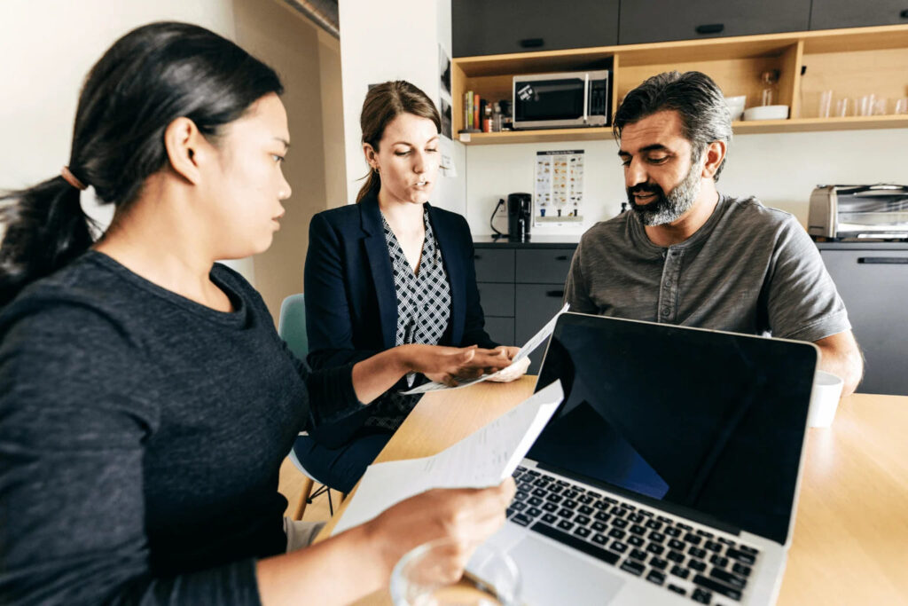 First-time home buyers reviewing mortgage | Homebuyer Mistakes in Orinda