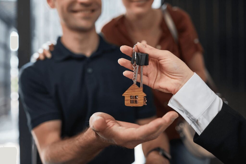 Happy homebuyers receiving keys